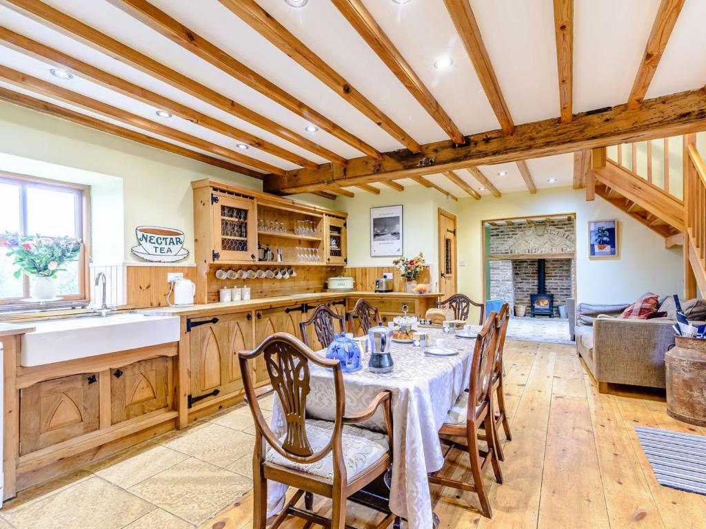 a kitchen and dining room with a table and chairs at Sir Francis Bigod - Uk31993 in Staithes