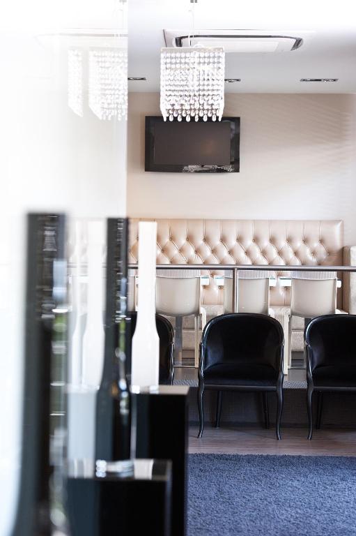 a view of a waiting room with chairs at Hotel Carla in Levanto