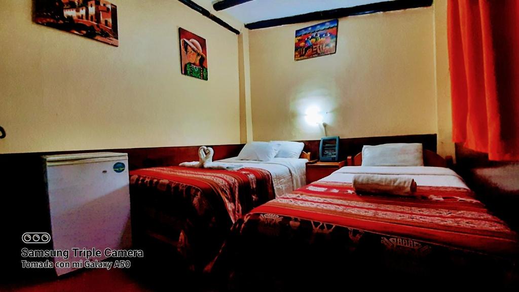 Postel nebo postele na pokoji v ubytování Hostal sambleño cusco Piero suite