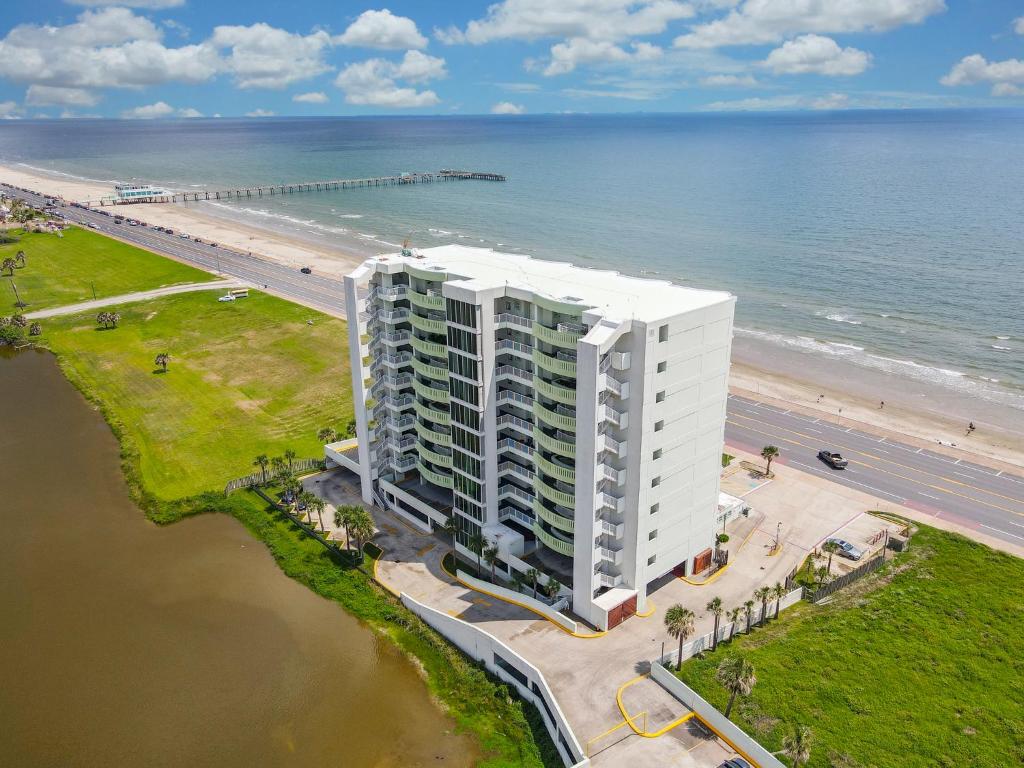 an aerial view of a large white building next to the beach at Galveston Luxury High Rise Oceanfront in Galveston