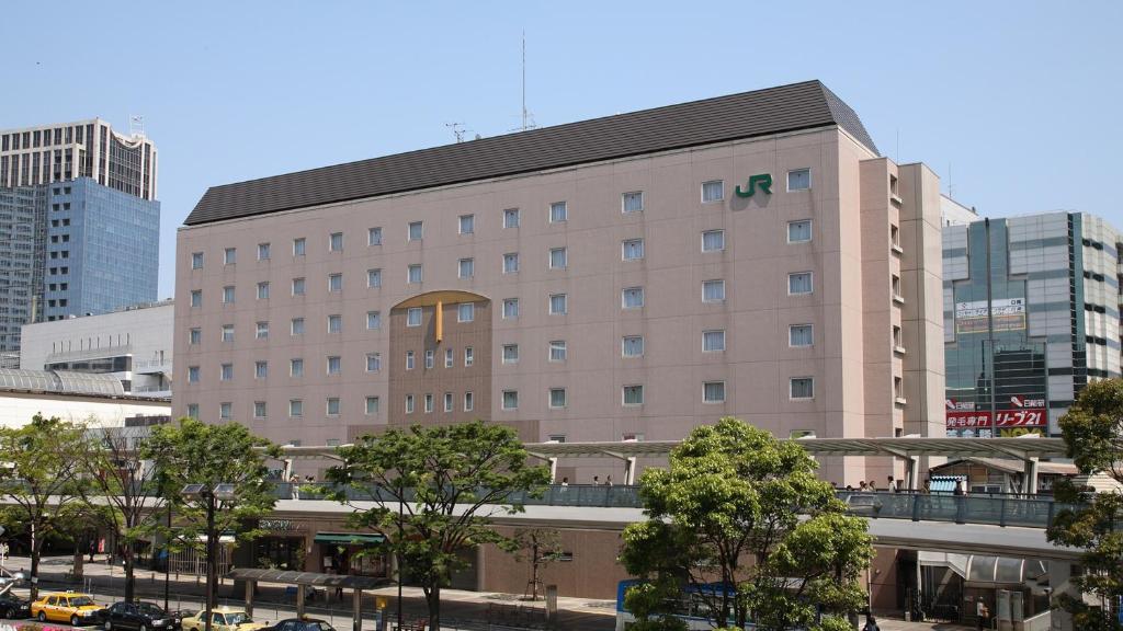 a large building in the middle of a city at JR-East Hotel Mets Kawasaki in Kawasaki
