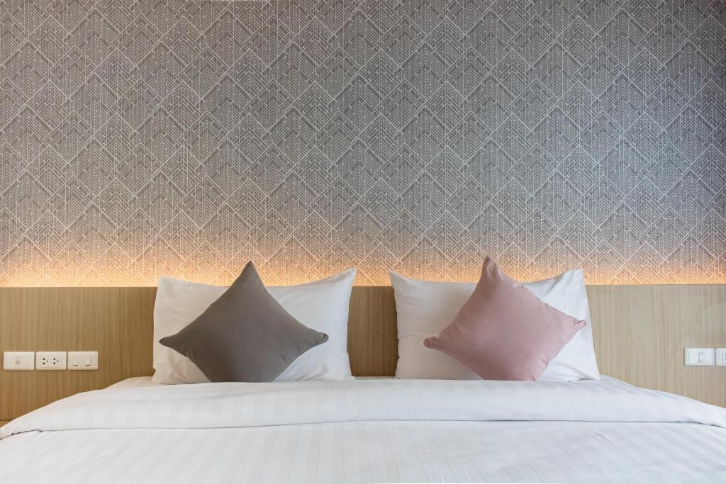 Postel nebo postele na pokoji v ubytování ONE Hotel