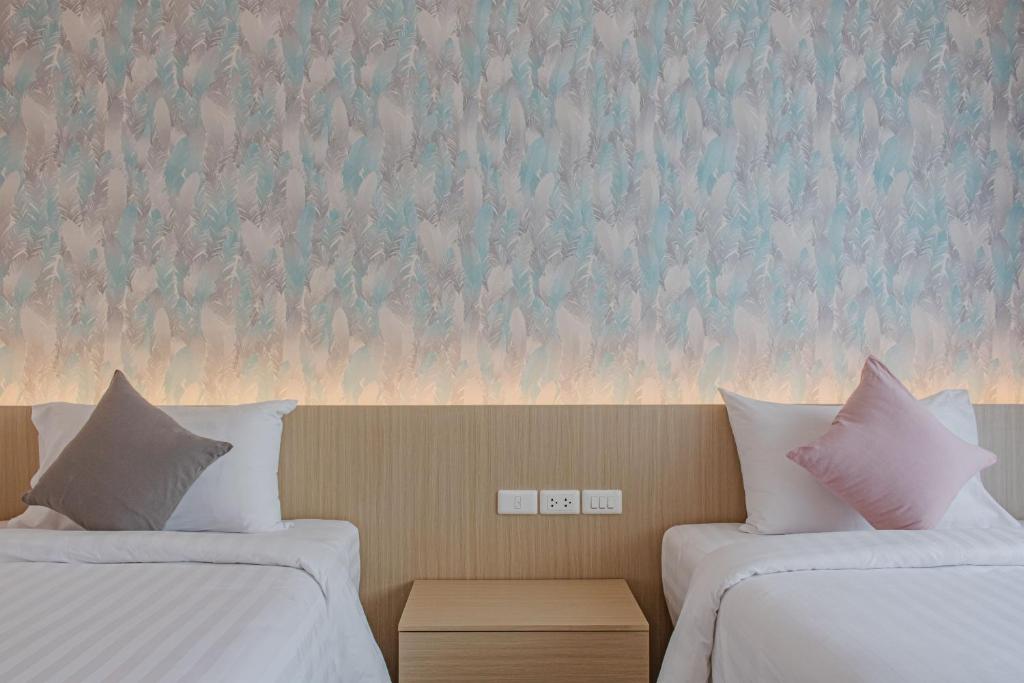 Postel nebo postele na pokoji v ubytování ONE Hotel