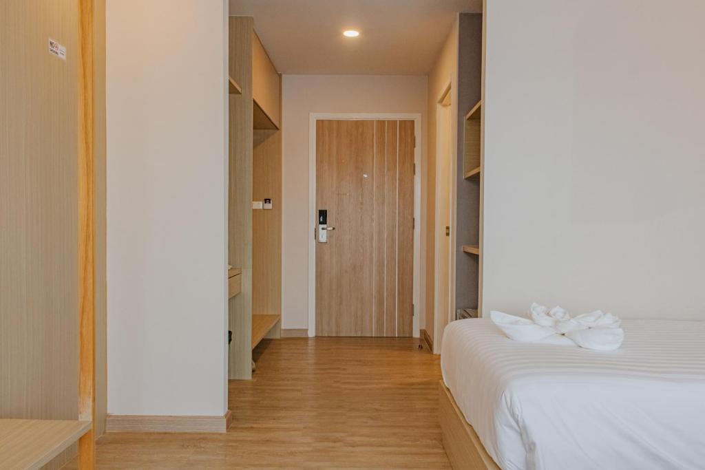 Postel nebo postele na pokoji v ubytování ONE Hotel