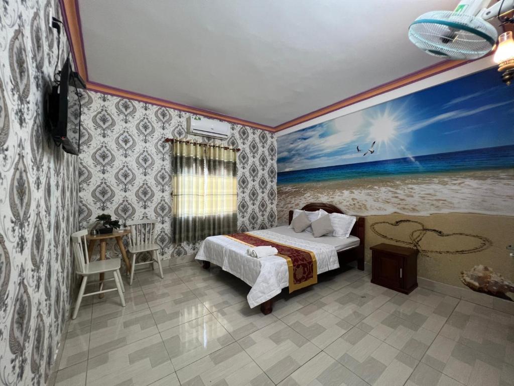 Postel nebo postele na pokoji v ubytování Nhà Nghỉ Hồng Trang - Thủ Dầu Một