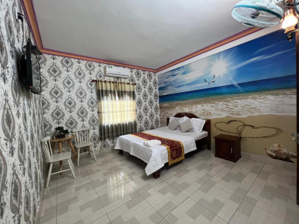 Postel nebo postele na pokoji v ubytování Nhà Nghỉ Hồng Trang - Thủ Dầu Một