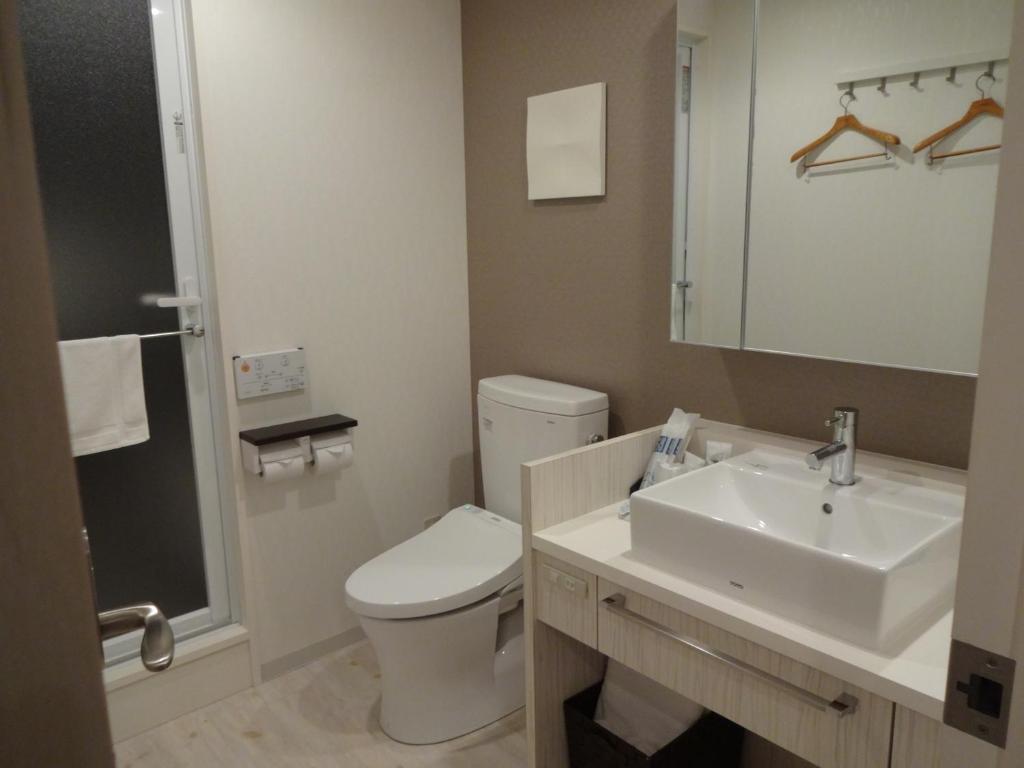 Koupelna v ubytování Amand Hotel