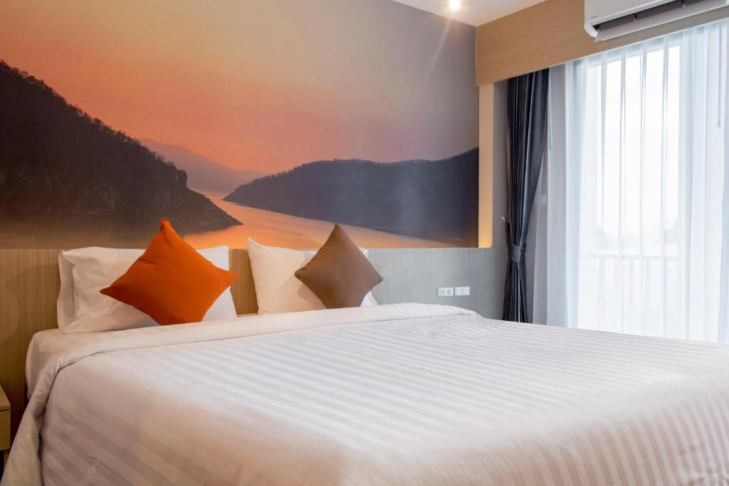 Postel nebo postele na pokoji v ubytování ONE Hotel