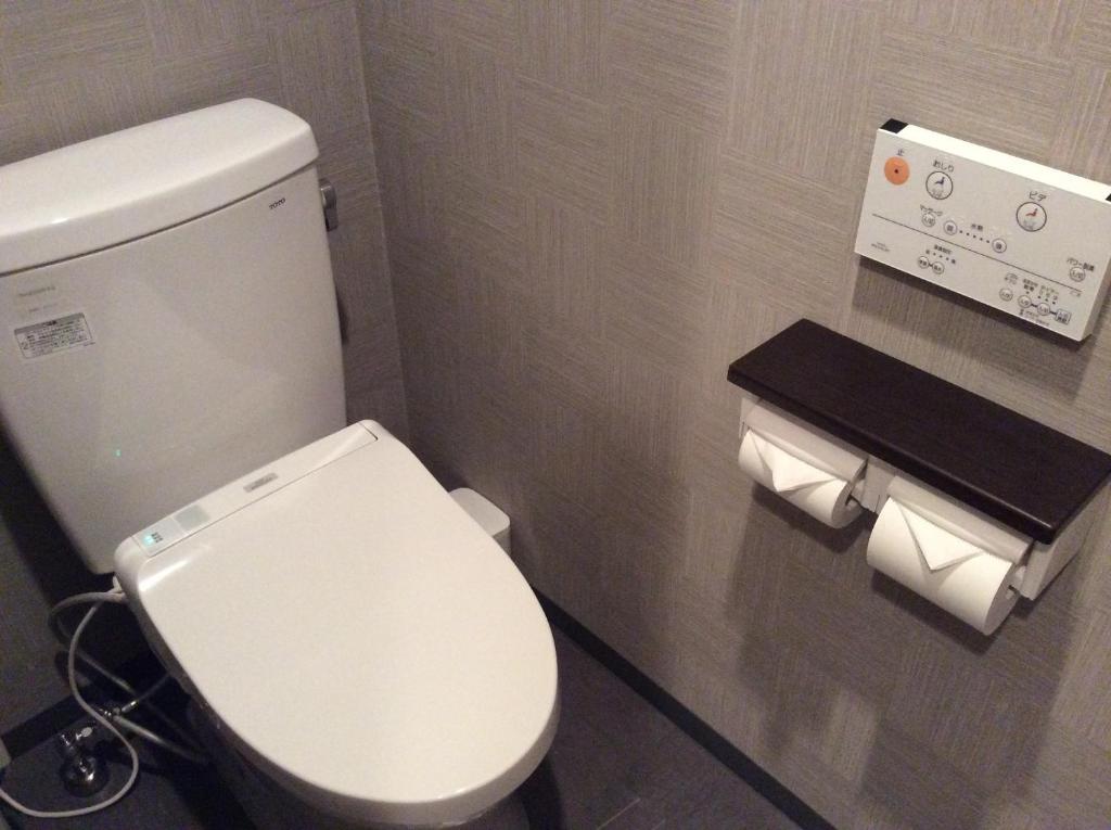 Koupelna v ubytování Amand Hotel