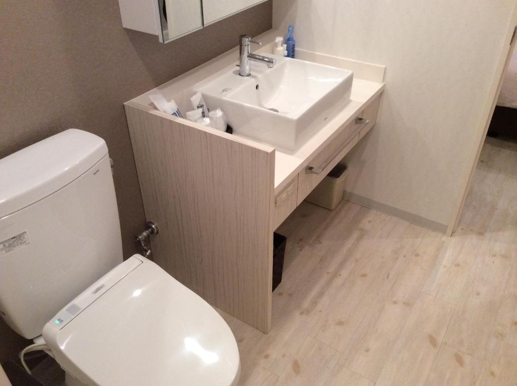 Koupelna v ubytování Amand Hotel