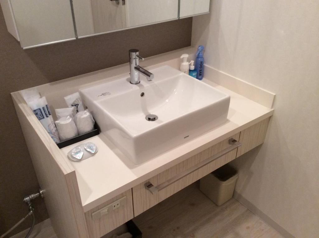 Koupelna v ubytování Amand Hotel