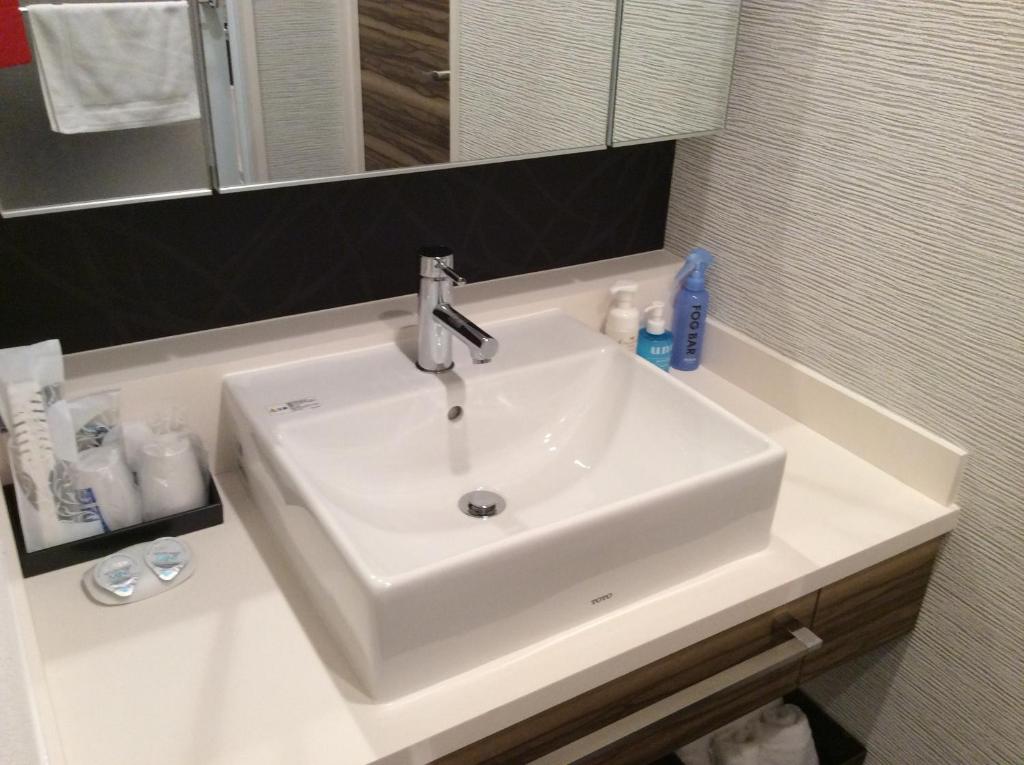 Koupelna v ubytování Amand Hotel