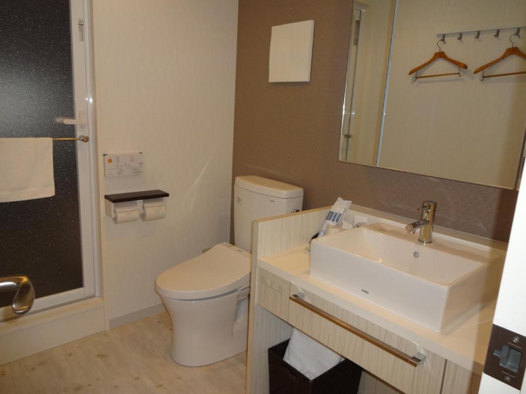 Koupelna v ubytování Amand Hotel