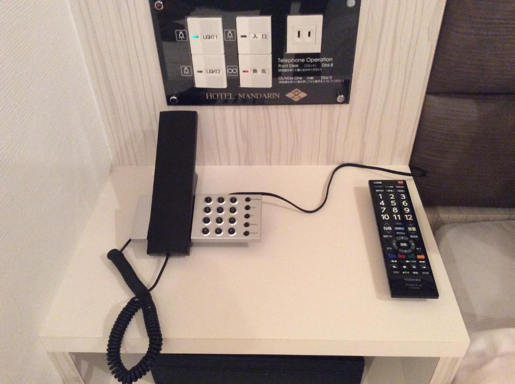 TV a/nebo společenská místnost v ubytování Amand Hotel