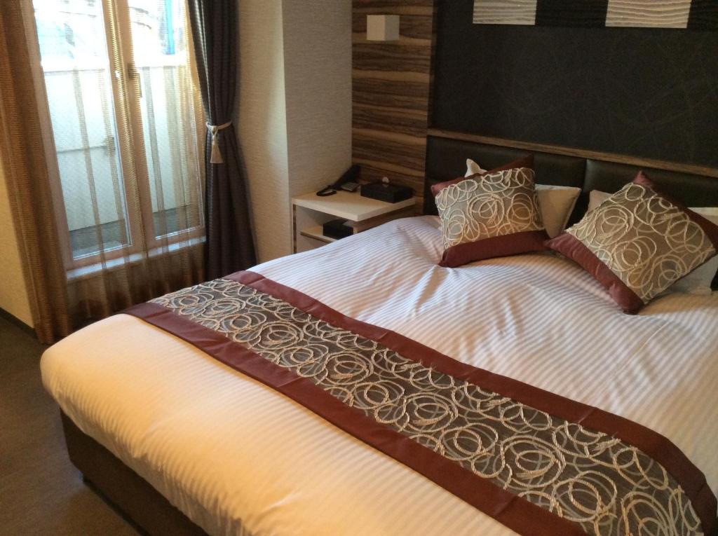 Postel nebo postele na pokoji v ubytování Amand Hotel