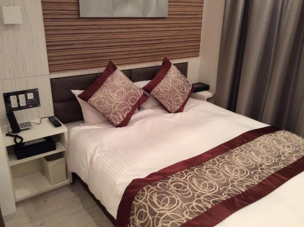 Postel nebo postele na pokoji v ubytování Amand Hotel