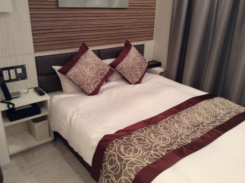 Postel nebo postele na pokoji v ubytování Amand Hotel
