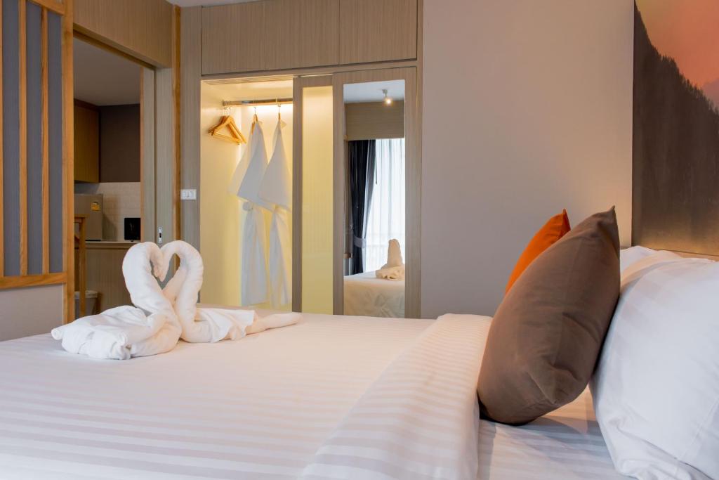 Postel nebo postele na pokoji v ubytování ONE Hotel