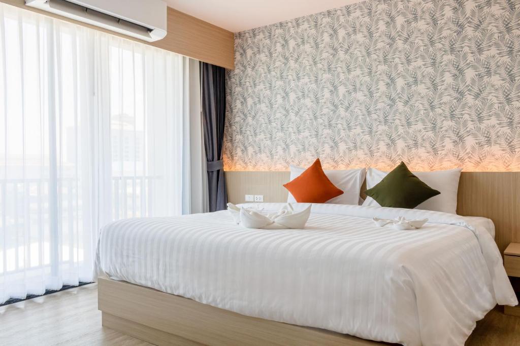 Postel nebo postele na pokoji v ubytování ONE Hotel