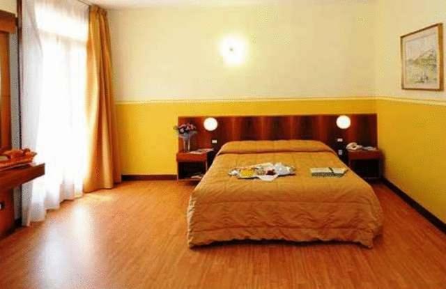 Postel nebo postele na pokoji v ubytování Park Hotel Jolanda