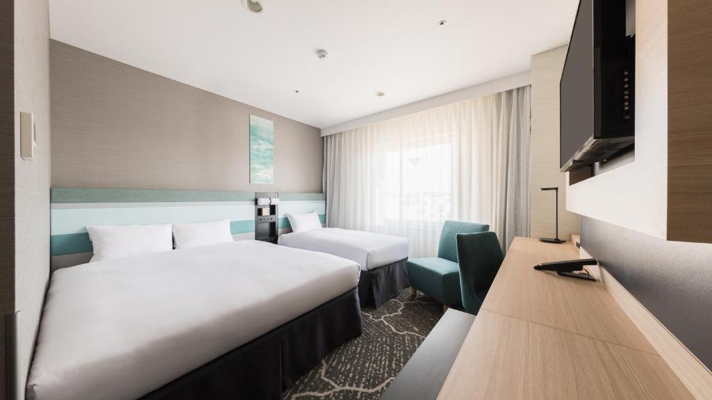 Postel nebo postele na pokoji v ubytování JR-East Hotel Mets Kamakura Ofuna