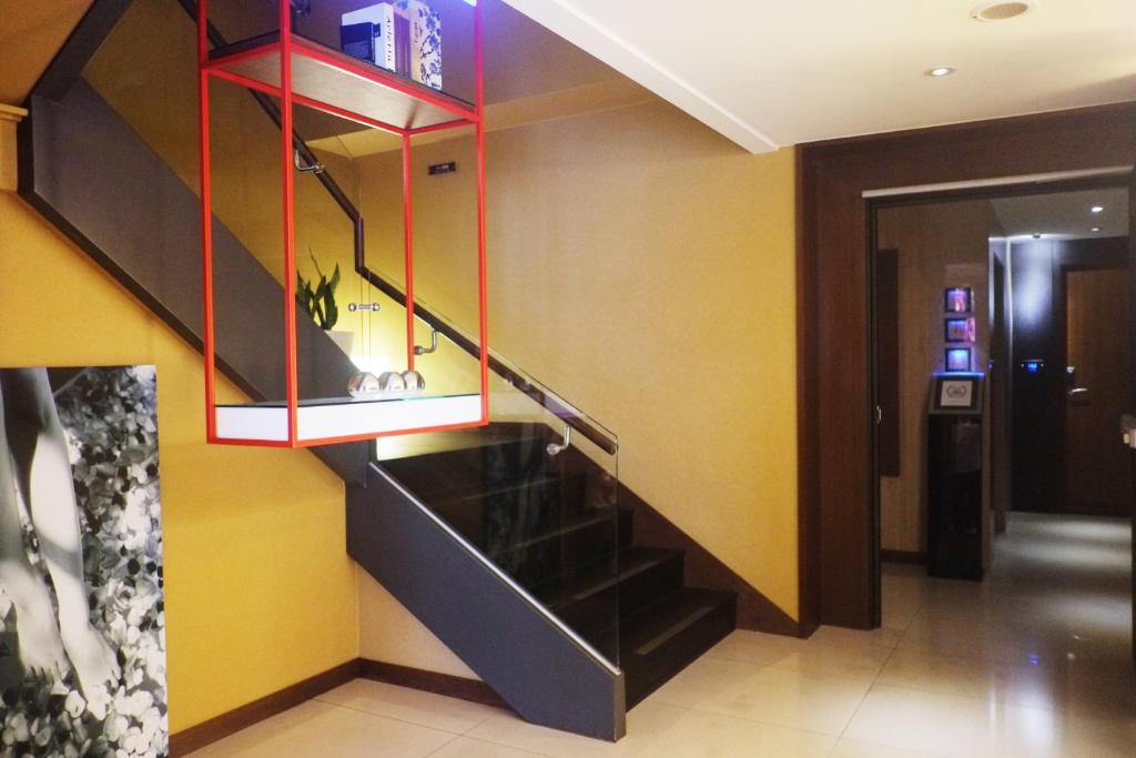 TV a/nebo společenská místnost v ubytování Aqua Bella Hotel