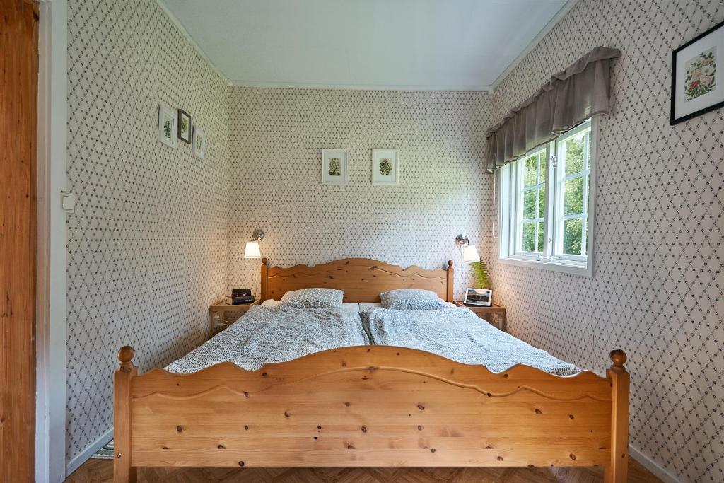 Postel nebo postele na pokoji v ubytování Savolax Stugor