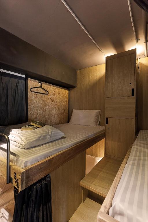Postel nebo postele na pokoji v ubytování Ximen Wow Hostel