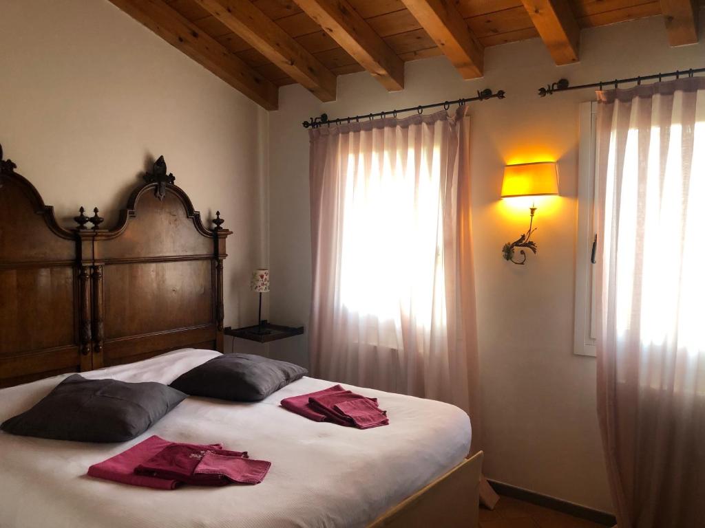 Postel nebo postele na pokoji v ubytování Agriturismo Terre Bianche