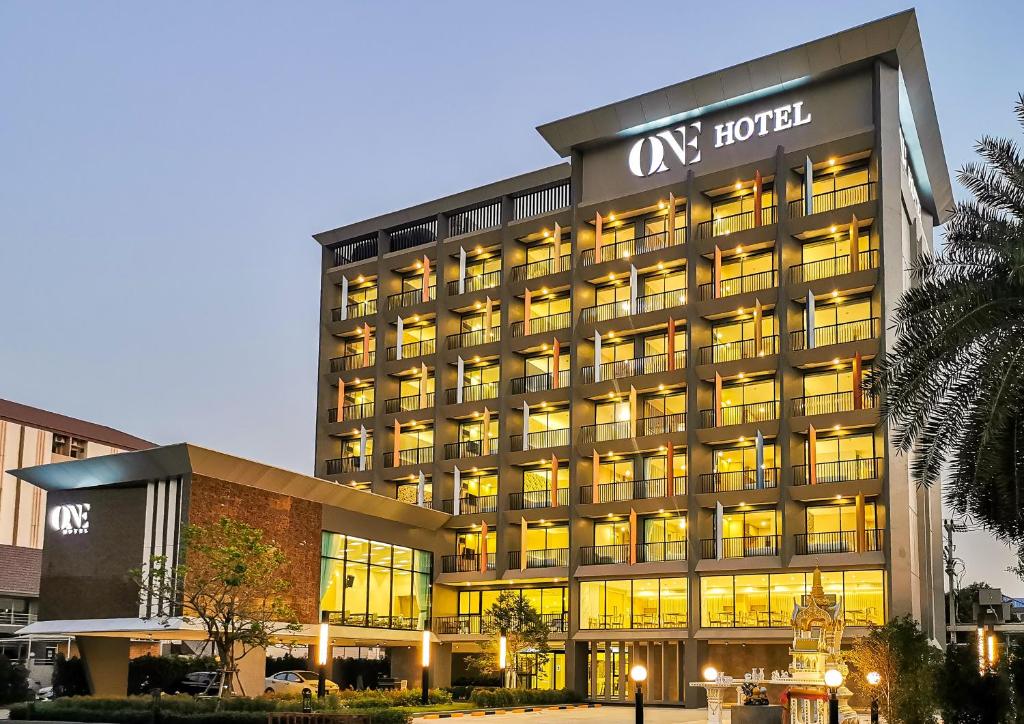 a hotel building with a lot of windows at ONE Hotel in Pathum Thani