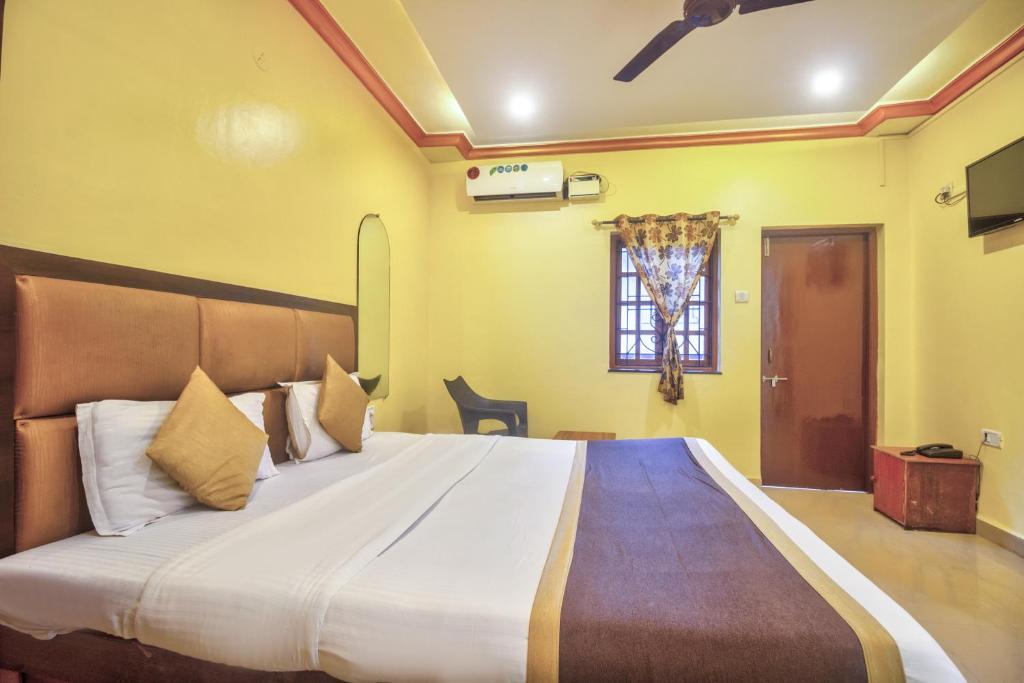 Postel nebo postele na pokoji v ubytování Hotel Purushottam Residency