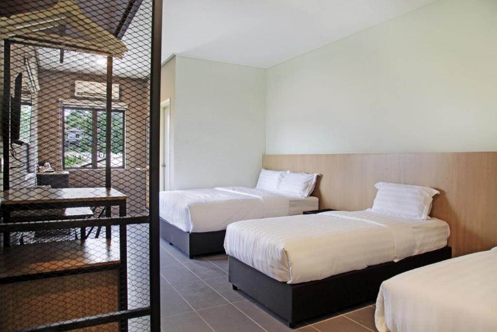 Postel nebo postele na pokoji v ubytování Hotel ali Imran
