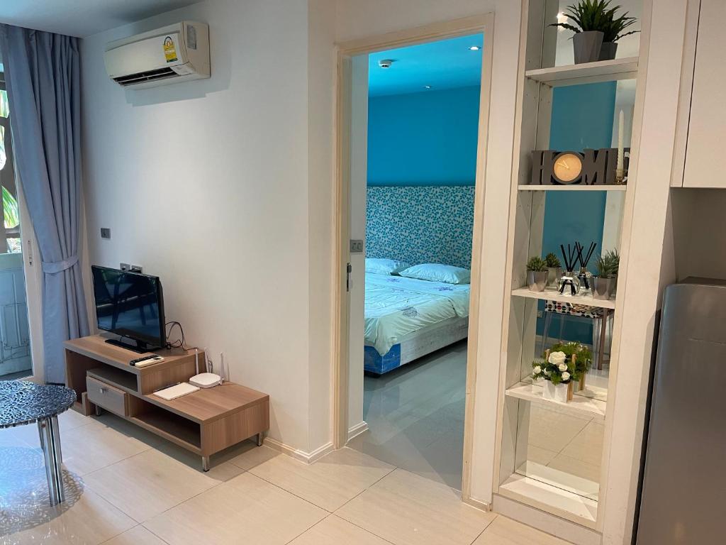 Postel nebo postele na pokoji v ubytování Atlantis Condo Resort Jomtien Beach