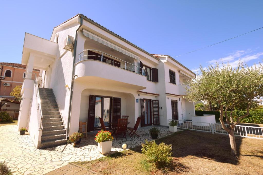 a villa with a view of the house at Apartments Cordasev in Vantačići