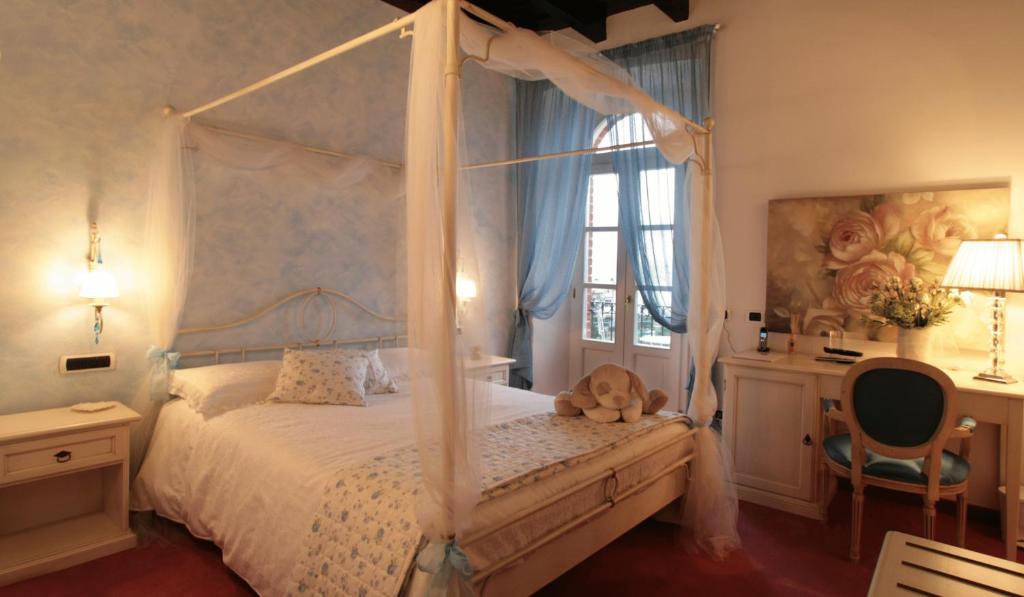Postel nebo postele na pokoji v ubytování Villa Baroni