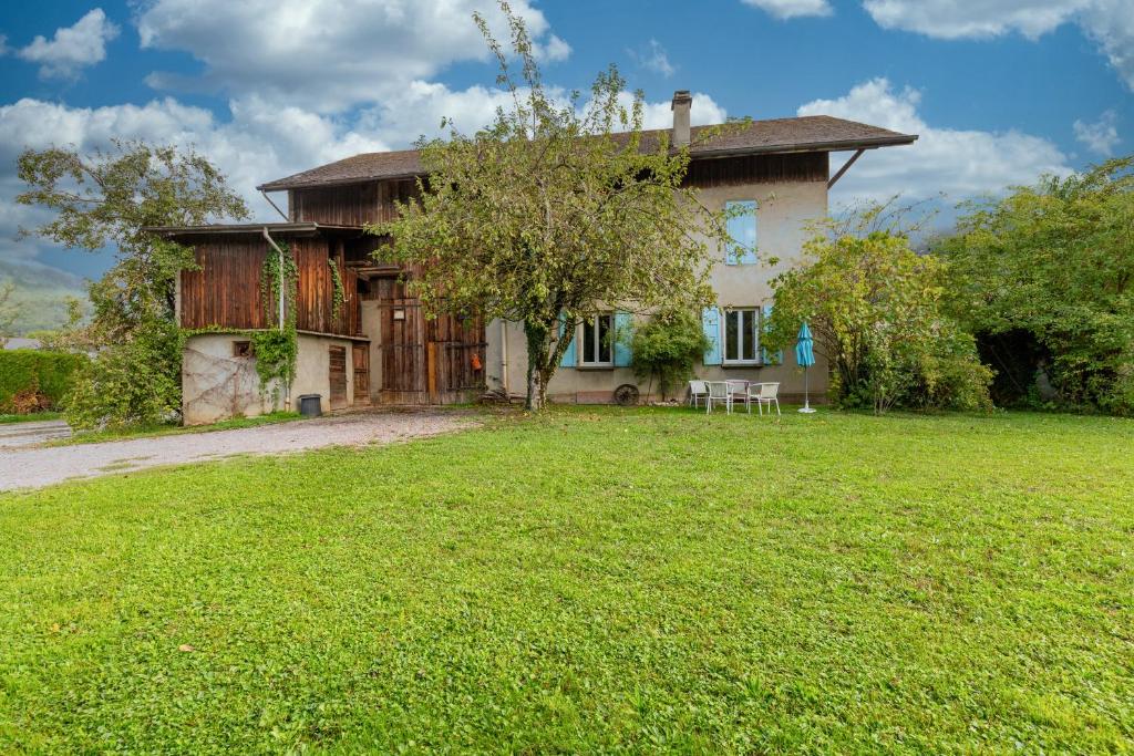 a house with a large yard in front of it at Gab's House Vallée in Thyez