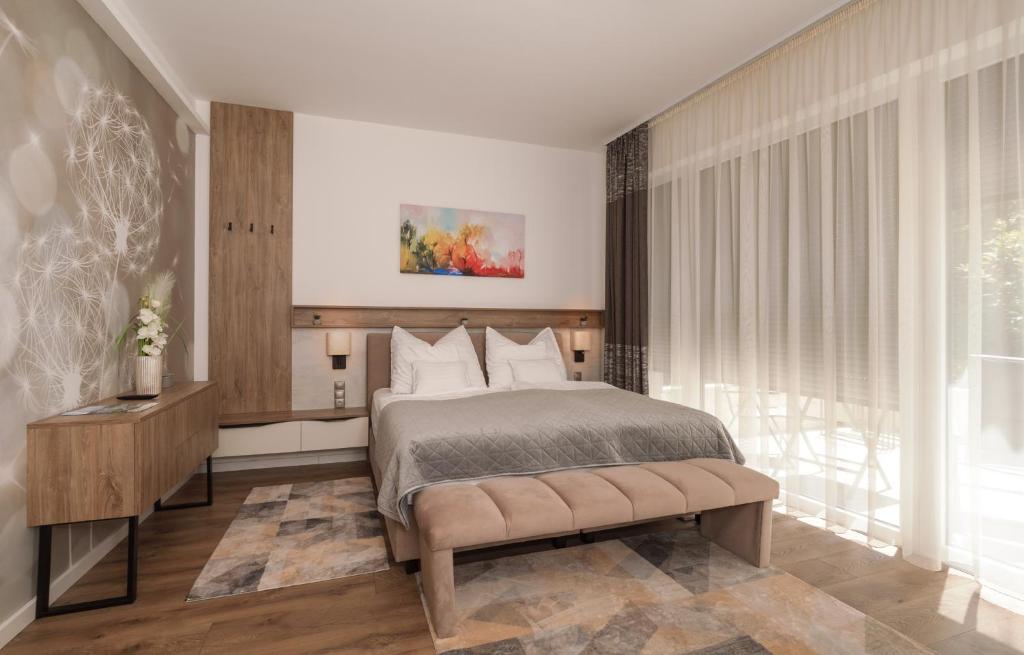 Posteľ alebo postele v izbe v ubytovaní Spa Residence Carbona Great Time Apartman