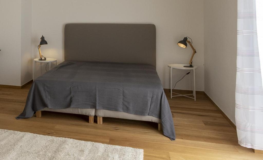 Posteľ alebo postele v izbe v ubytovaní Flataid Apartmenthaus Brauhausstrasse