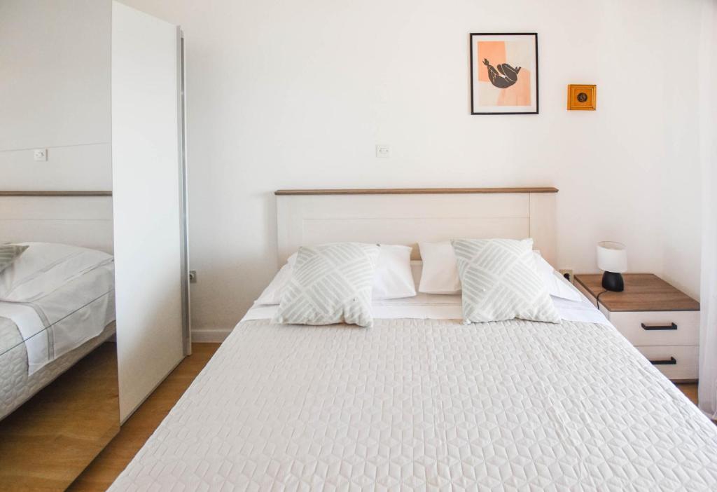 Łóżko lub łóżka w pokoju w obiekcie Apartments Anchor