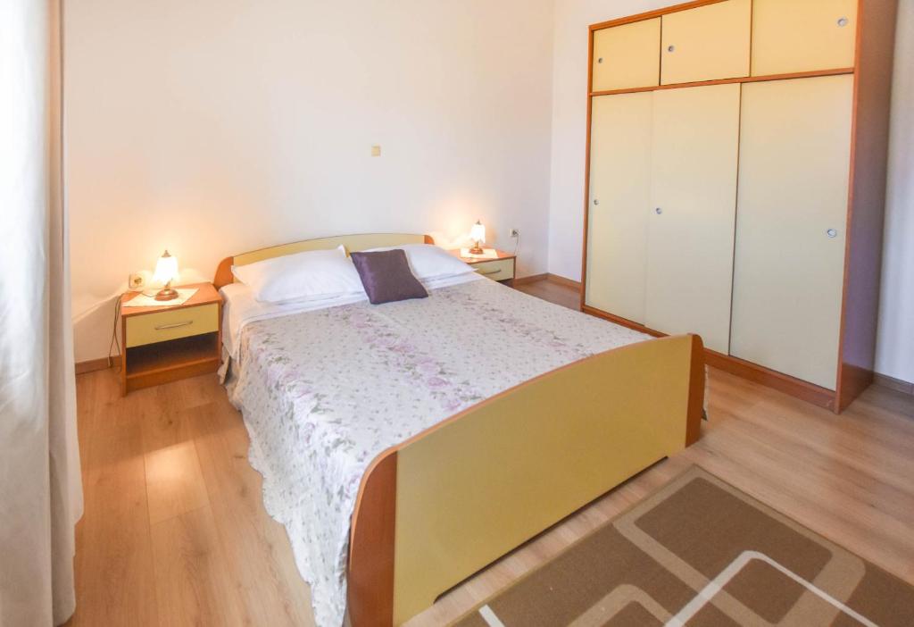 Łóżko lub łóżka w pokoju w obiekcie Apartments Anchor