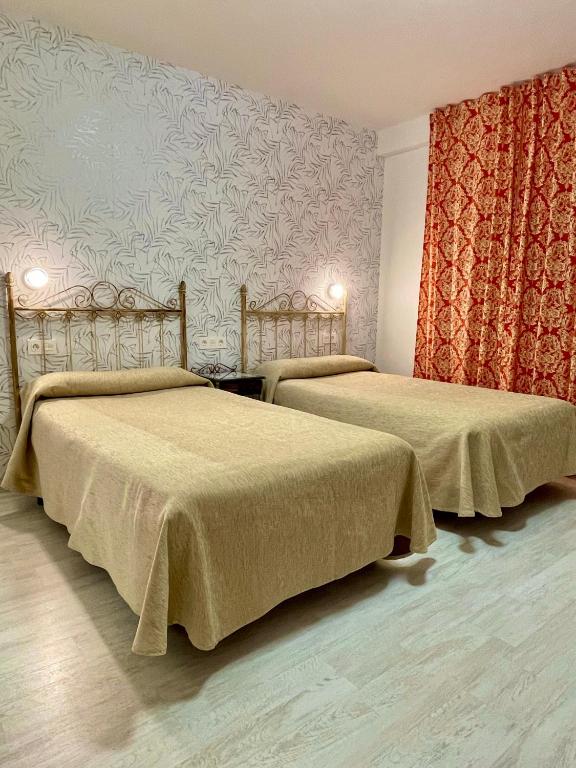 Cama o camas de una habitación en Hotel Manzanito