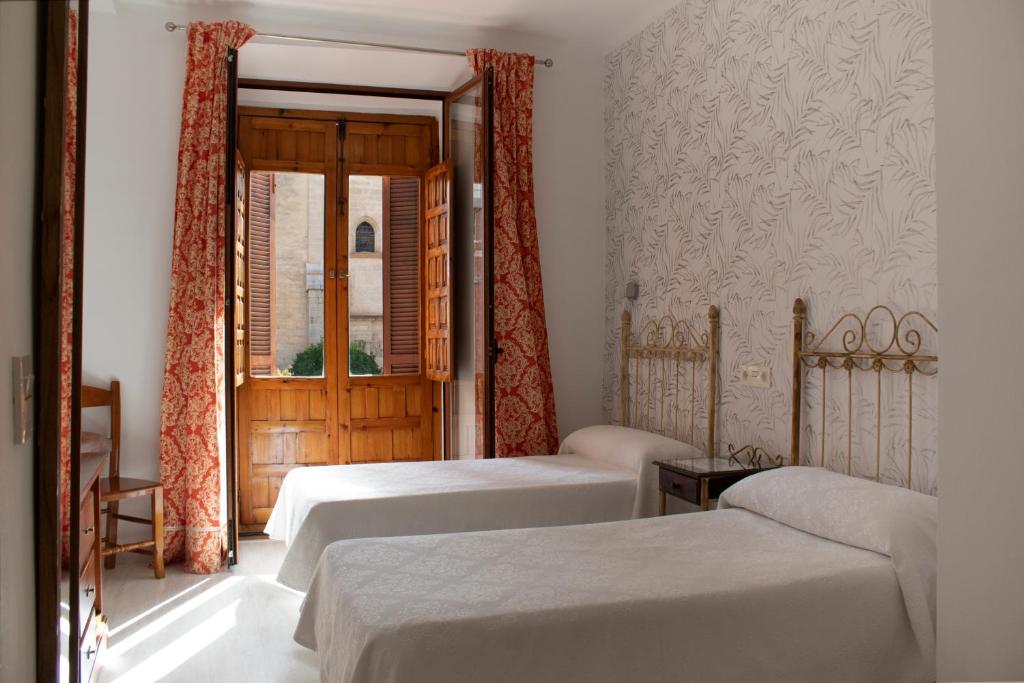 Cama o camas de una habitación en Hotel Manzanito