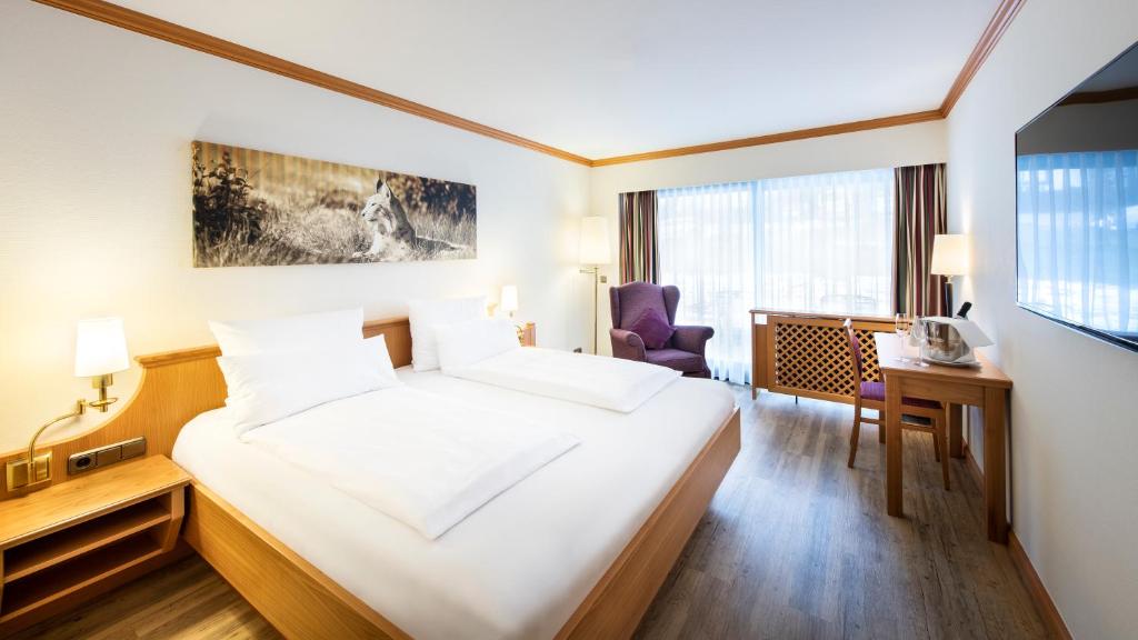 Postel nebo postele na pokoji v ubytování Sonnenhof Resort Bayerischer Wald
