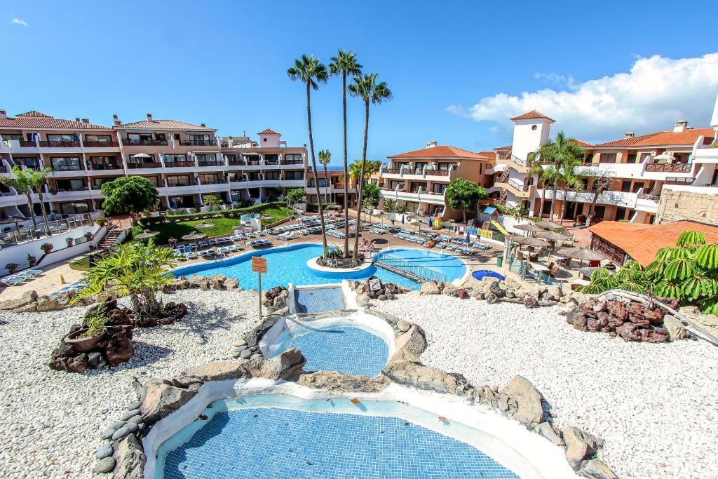 an aerial view of a resort with two pools at Paradise Gardens - Golf del Sur in San Miguel de Abona