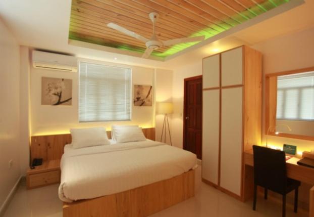 Postel nebo postele na pokoji v ubytování PINE LODGE MALDIVES