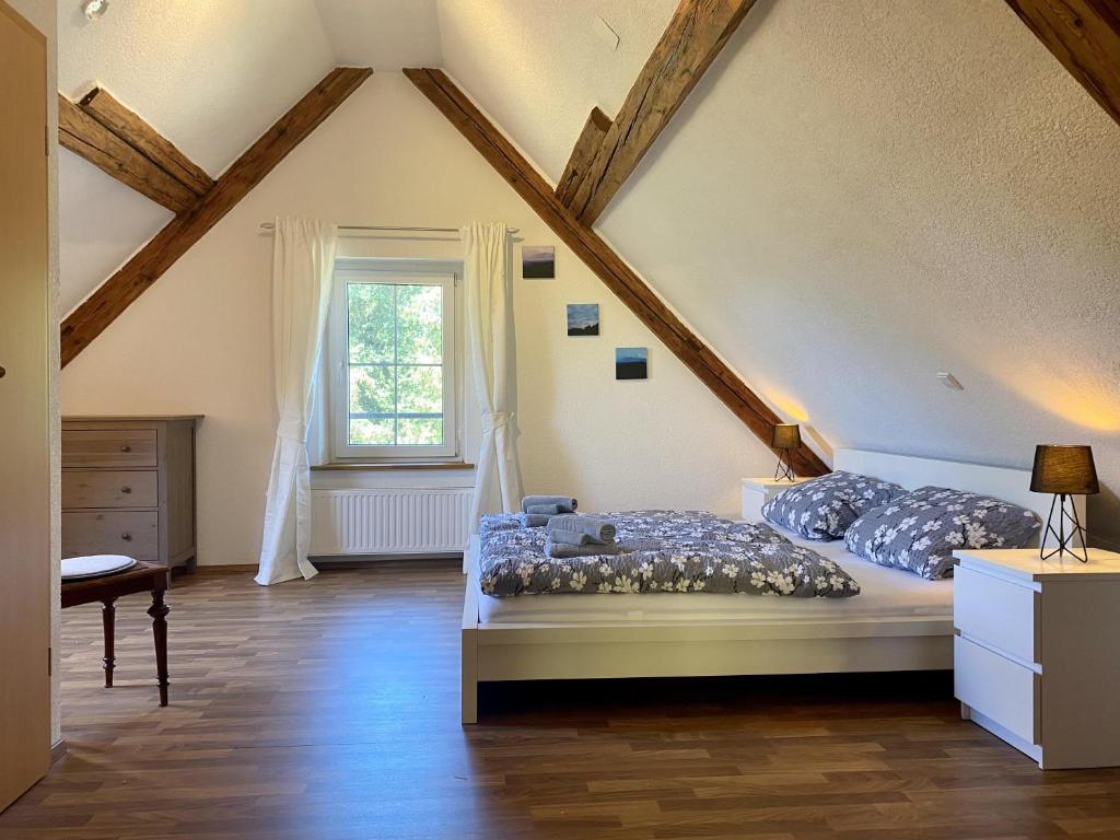 a bedroom with two beds and a window at Ferienhof Weber Nieratz in Wangen im Allgäu