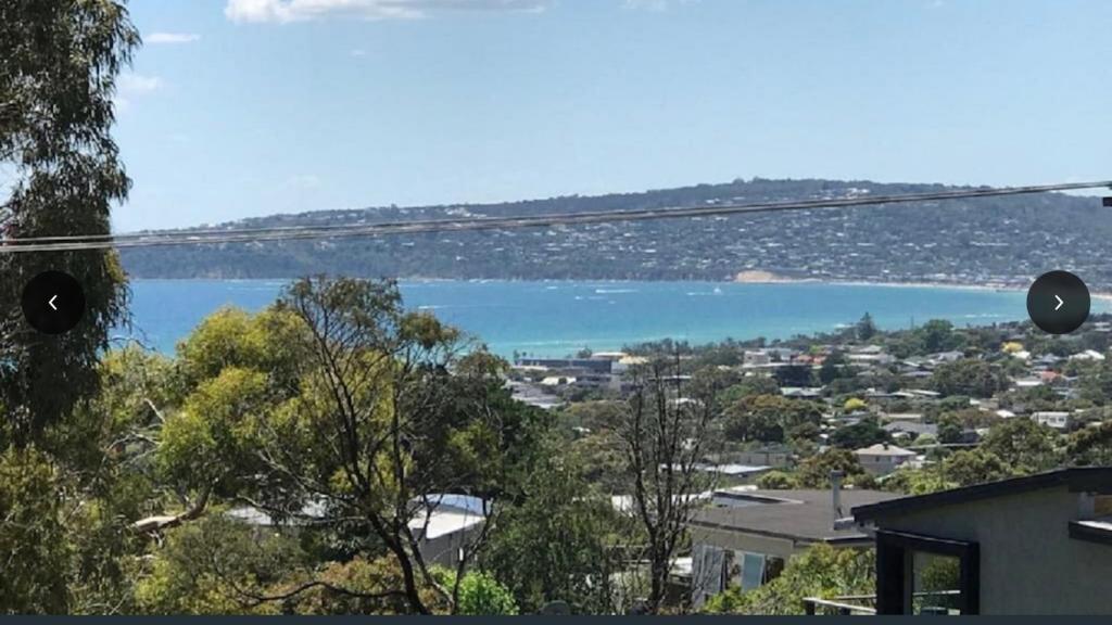 a view of a body of water with a city at Family Beach Home Dromana in Dromana