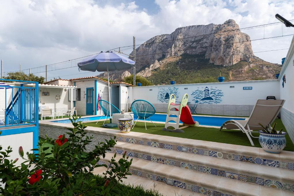 a house with a view of a mountain at Villa Vista Mare Cinisi in Cinisi