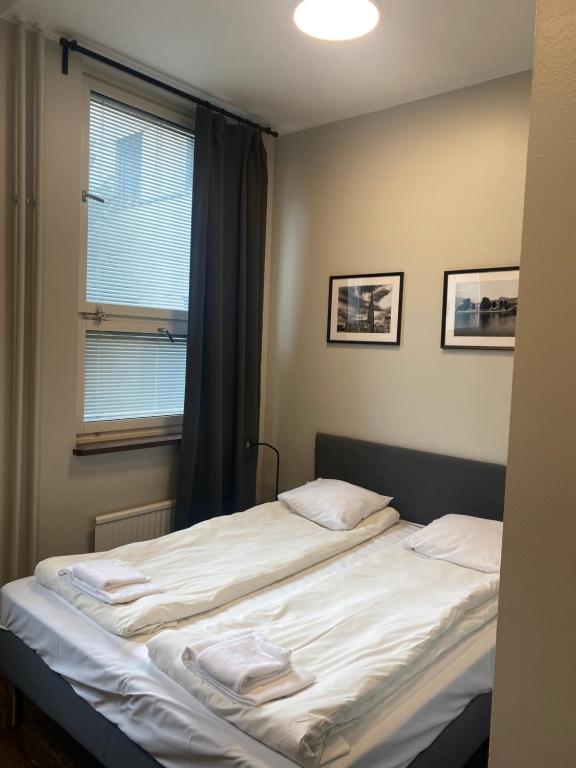 Säng eller sängar i ett rum på Metro Apart Hotel