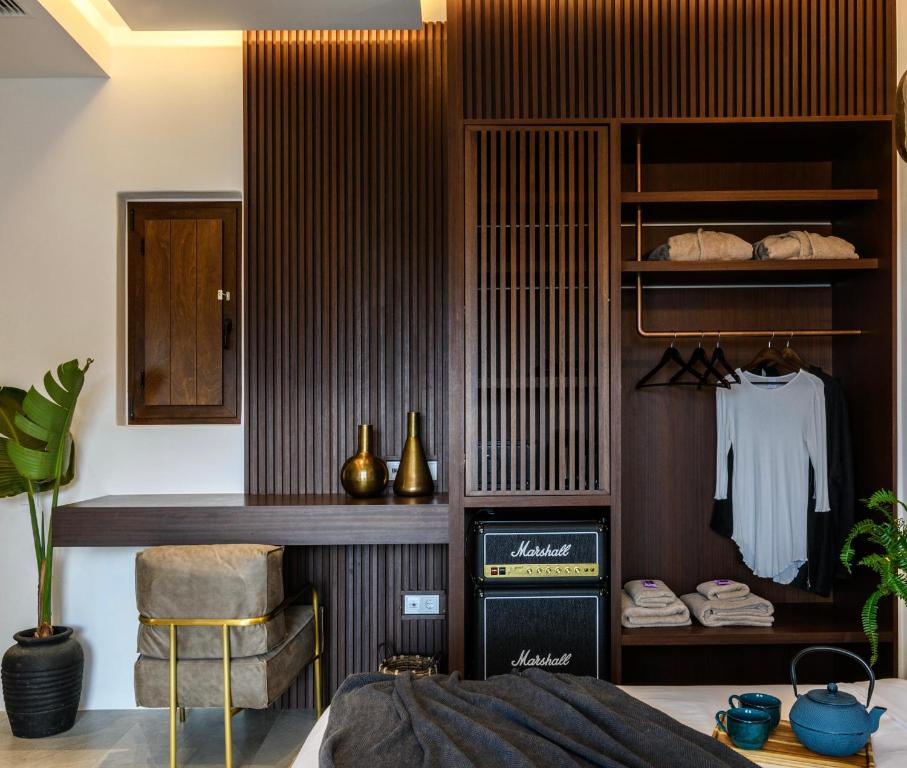 Postel nebo postele na pokoji v ubytování Charisma Hotel and Wellness Club